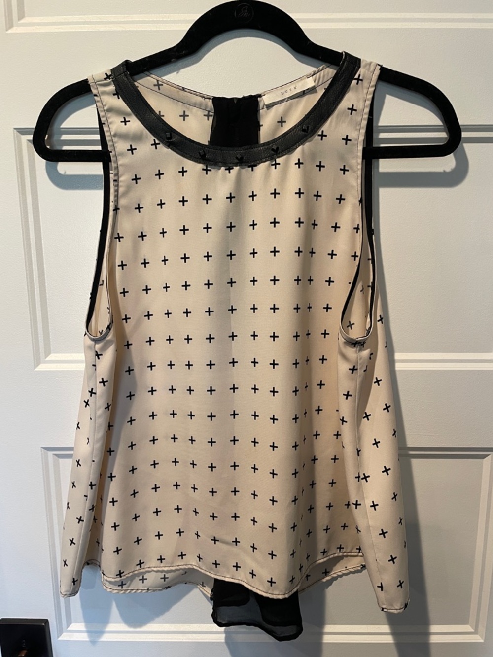 Lush Cream Sleeveless Blouse with Black Cross Print and Trim